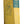 A vintage hardcover book titled 'The Yearbook of Agriculture 1959' with a yellow cover and a teal spine band, photographed resting on a wooden shelf.