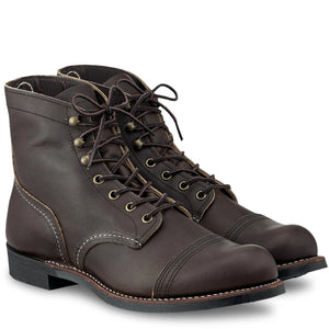 A pair of Red Wing Shoes Iron Rangers 4606 in dark brown leather lace-up boots with brass-tone metal eyelets and contrast stitching, shown on a clean white background.