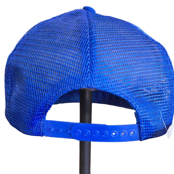 A bright blue mesh trucker cap displayed on a black stand on a store counter.